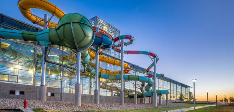 Epic Waters Waterpark waterslides view from the exterior at sunset in Grand Prairie, Texas